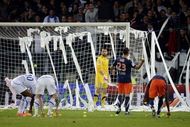 Auxerre's supporters throw tennis balls and toilet paper on the pitch